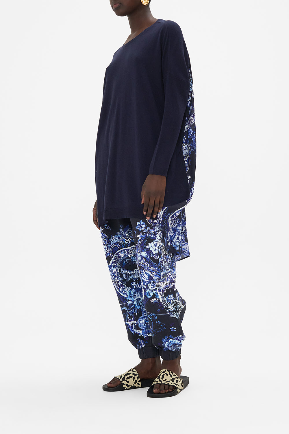 Side view of model wearing CAMILLA printed jumper in Delft Dynasty print 