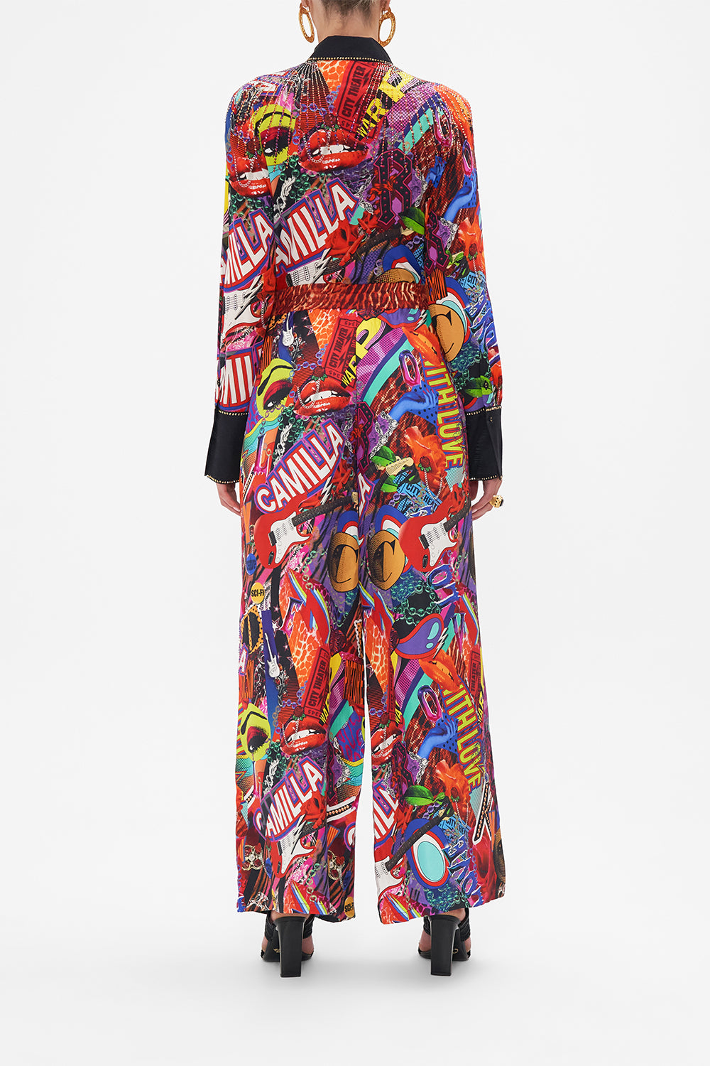 Back view of model wearing CAMILLA silk palazzo pants in multicoloured Radical Rebirth print
