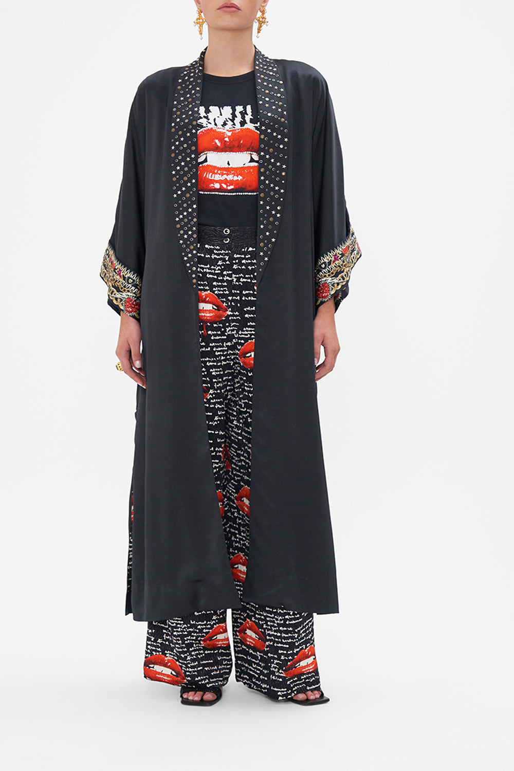 Front view of model wearing CAMILLA black silk robe in Radical Rebirth print