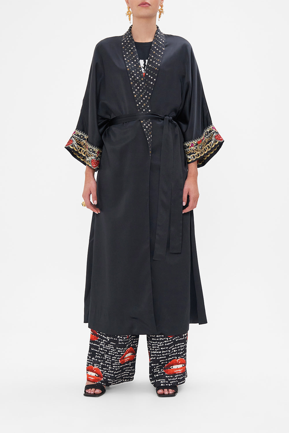 Front closed view of model wearing CAMILLA black silk robe in Radical Rebirth print