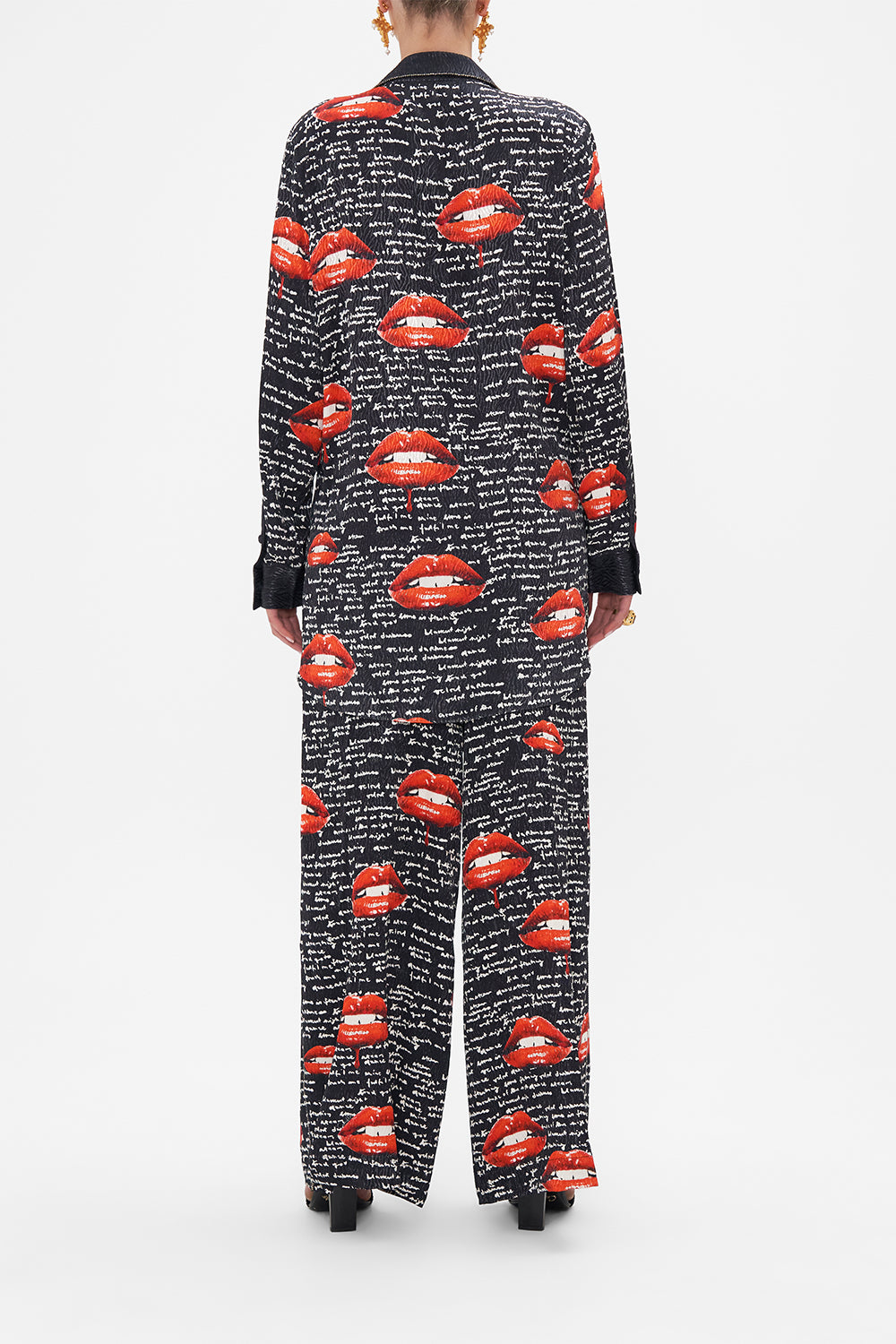 Back view of model wearing CAMILLA black blazer in Chaos Magic print 