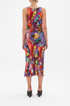Back view of model wearing CAMILLA bias silk slip dress in multicoloured Radical Rebirth print