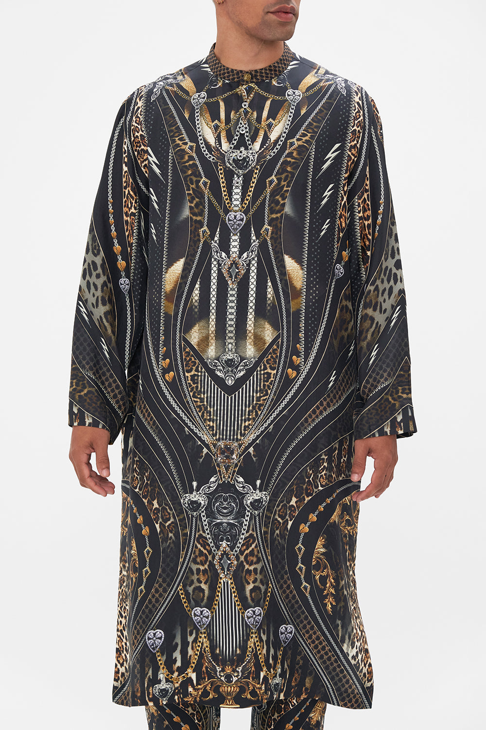 Crop view of model wearing Hotel Franks by CAMILLA mens silk kaftan in Chaos In The Cosmos animal print 