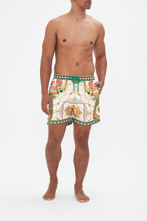 Front view of model wearing Hotel Franks by CAMILLA mens white boardshorts in My Sweet Devotion print