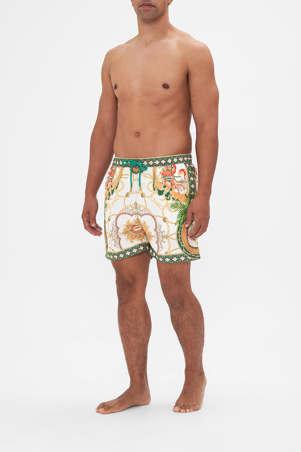 Side view of model wearing Hotel Franks by CAMILLA mens white boardshorts in My Sweet Devotion print