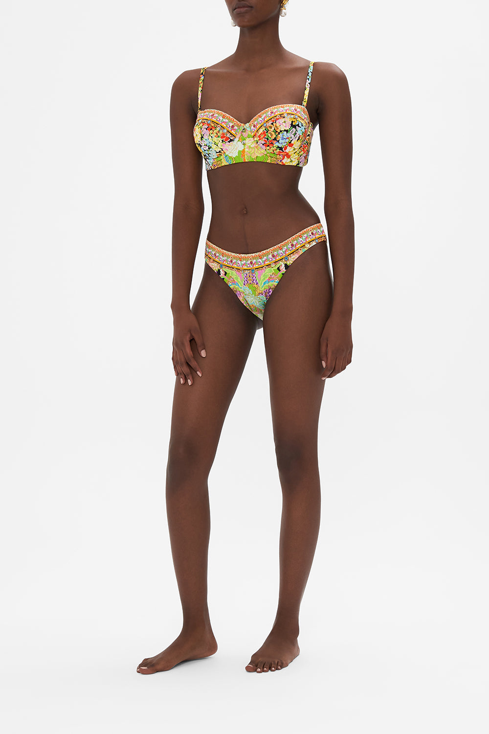 Side view of model wearing CAMILLA swimwear printed bikini bottoms in Sundowners in Sicily print