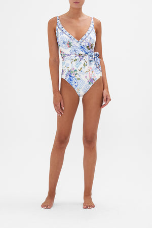 Front view of model wearing CAMILLA swimwear blue and white floral one piece swimsuit in Paint Me Positano print