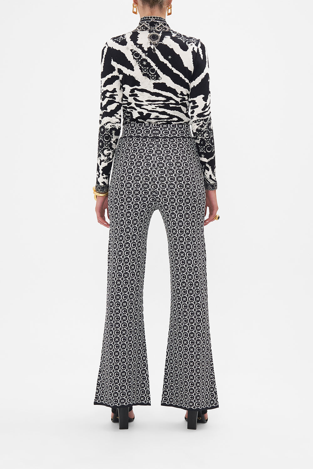 Back view of model wearing CAMILLA silk shirt in Song Of Sacrifice print