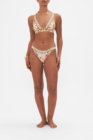 Front view of model wearing CAMILLA printed bikini bottoms in Bambino Bliss print