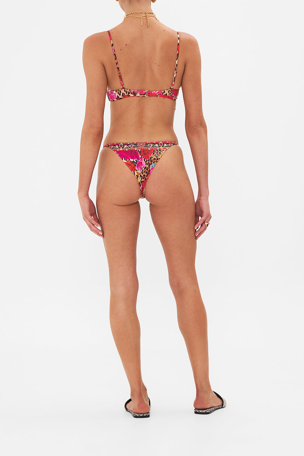 Back view of model wearing CAMILLA resortwear bikini bottom in Heart Like A Wildflower print