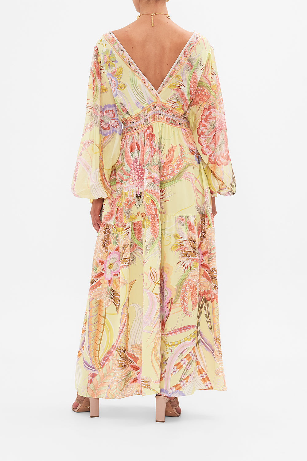 Back view of model wearing CAMILLA long sleeve silk dress in Cosmic Tuscan print