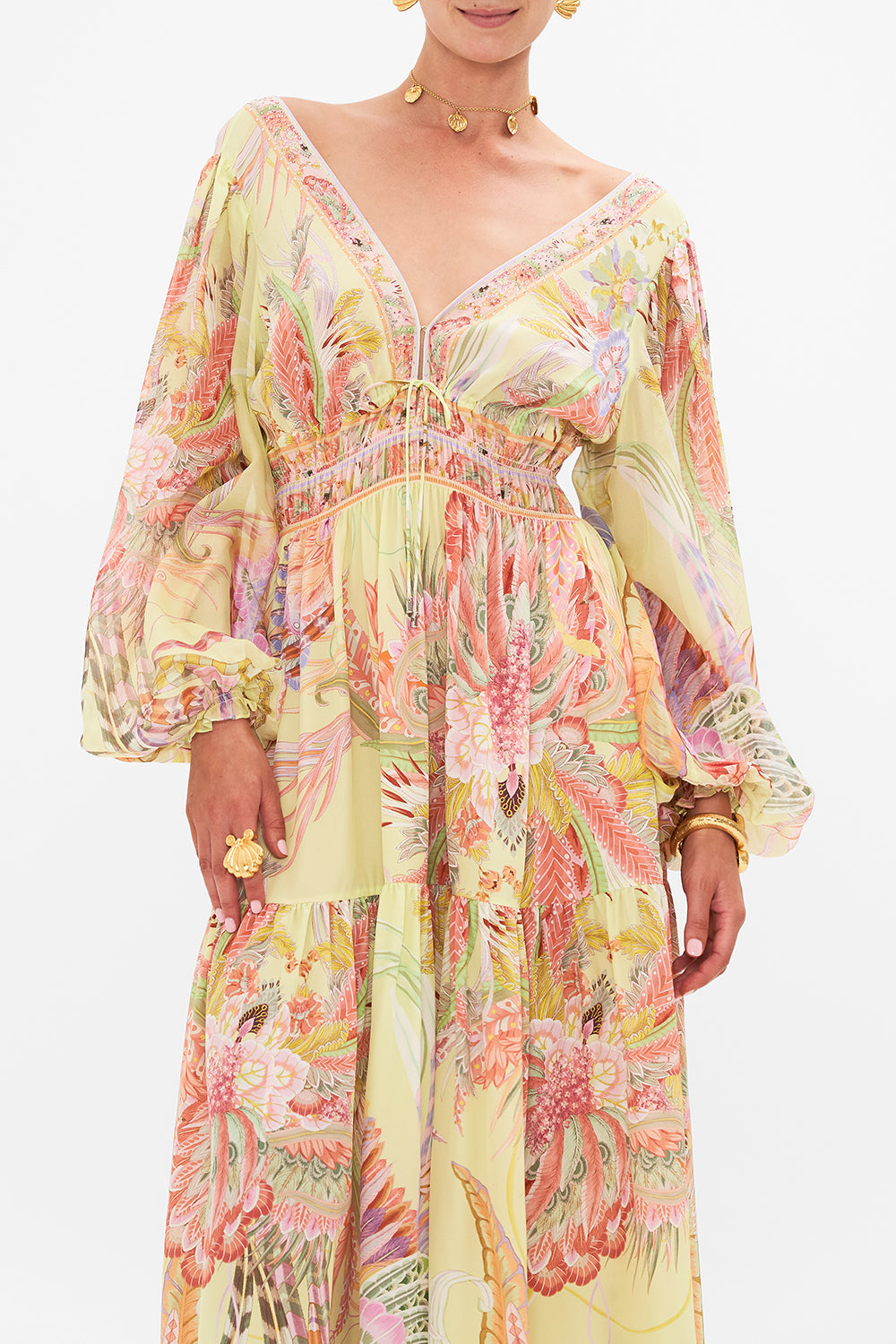 Crop view of model wearing CAMILLA long sleeve silk dress in Cosmic Tuscan print