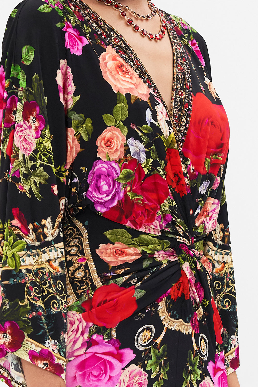 Detail view of model wearing CAMILLA jersey dress in Reservation For Love print