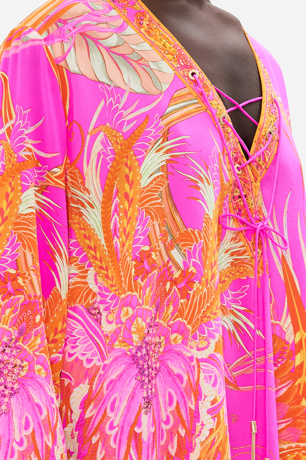 Detail view of model wearing CAMILLA designer kaftan in A Heart That Flutters print