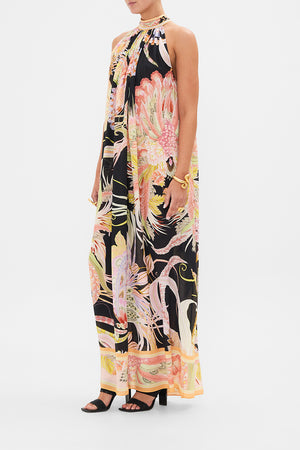 Side view of model wearing CAMILLA silk floral maxi dress in Lady of The Moon print