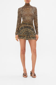 Front view of model wearing CAMILLA Crystal fringe mini skirt in Masked Moonlight print