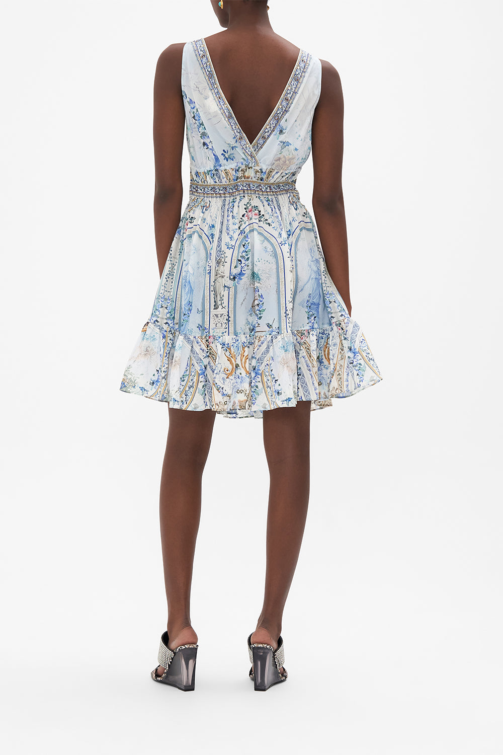 Back view of model wearing CAMILLA silk mini dress in Season of tHe Siren print 