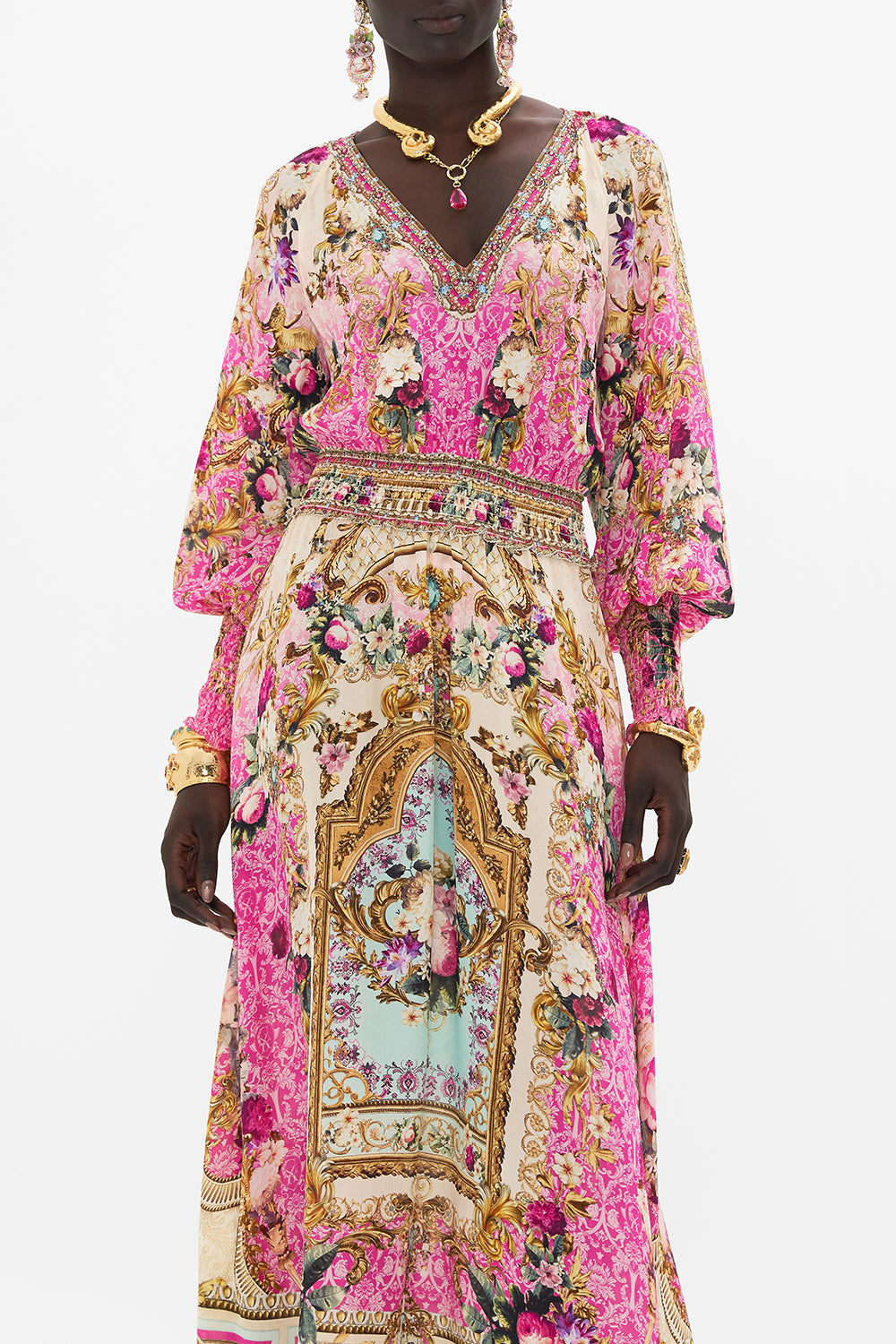 Crop view of model wearing CAMILLA silk pink maxi dress in Call Of The Canal print 