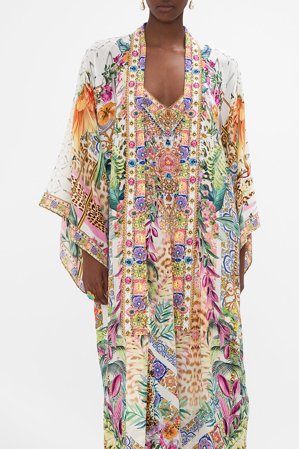 Crop view of model wearing CAMILLA floral silk kimono in Flowers of Neptune print
