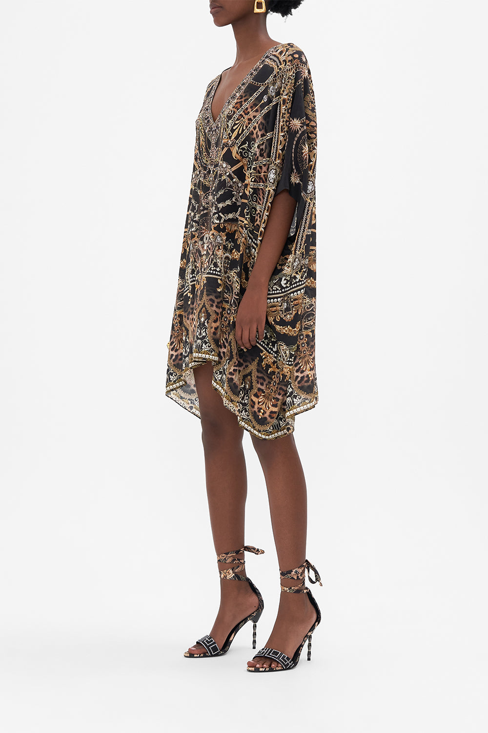 Side view of model wearing CAMILLA siilk kaftan in masked At Moonlight print