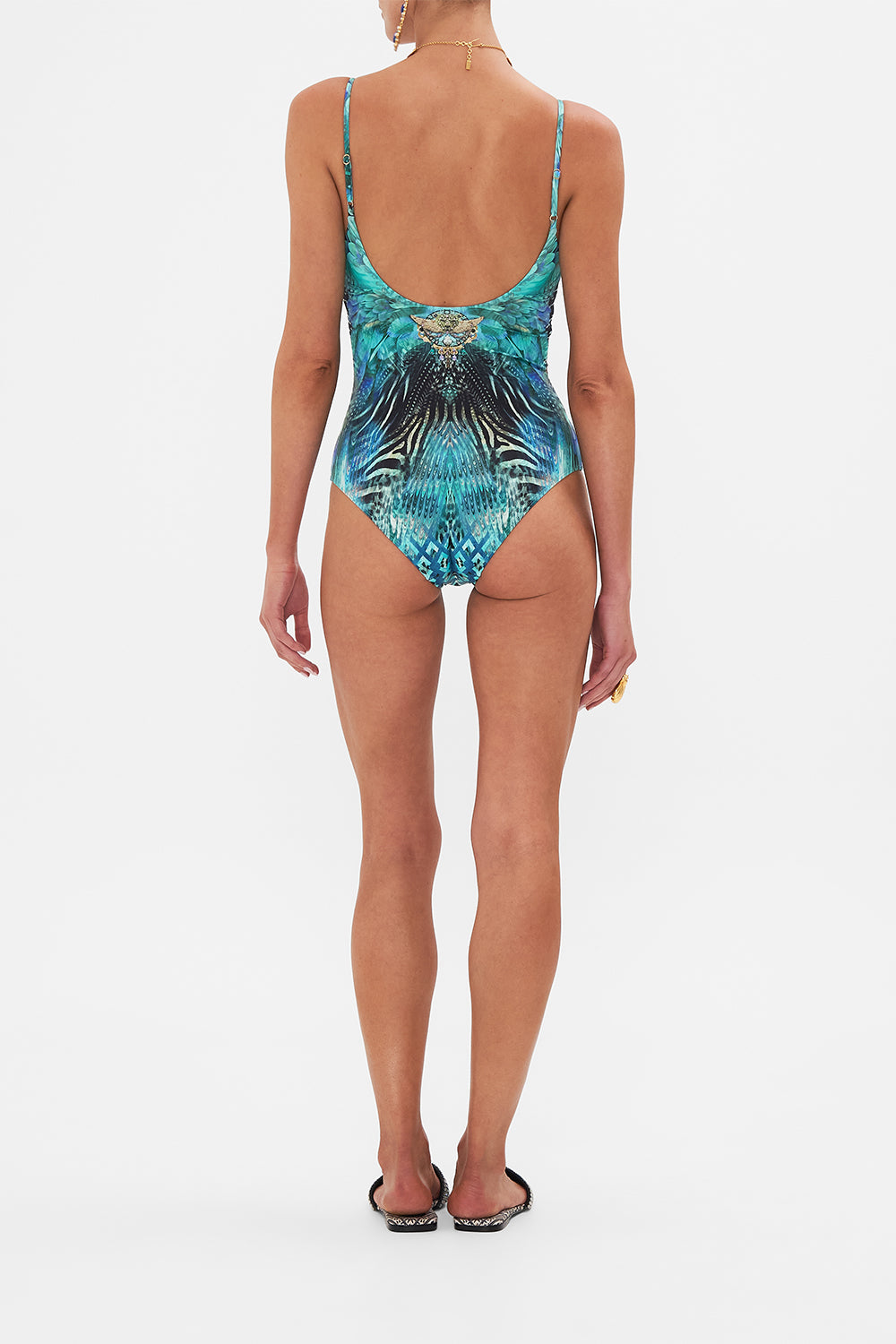 Back view of model wearing CAMILLA designer one piece swimsuit in Azure Allure