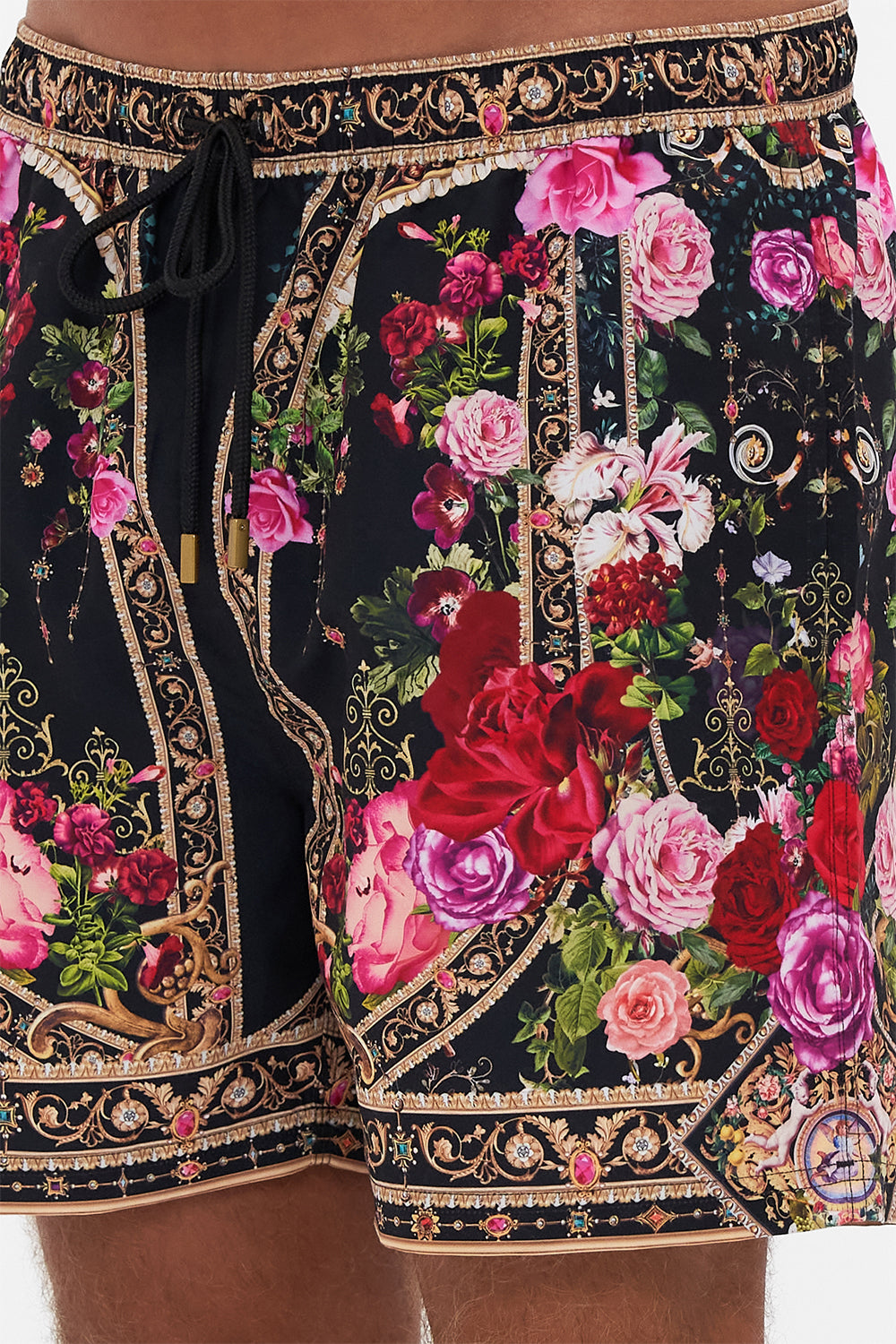 Detail view of model wearing Hotel Franks by CAMILLA mens boardshorts in Reservation For Love print 