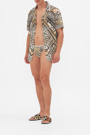 Back view of model wearing CAMILLA designer t shirt in Sky Cheetah print 