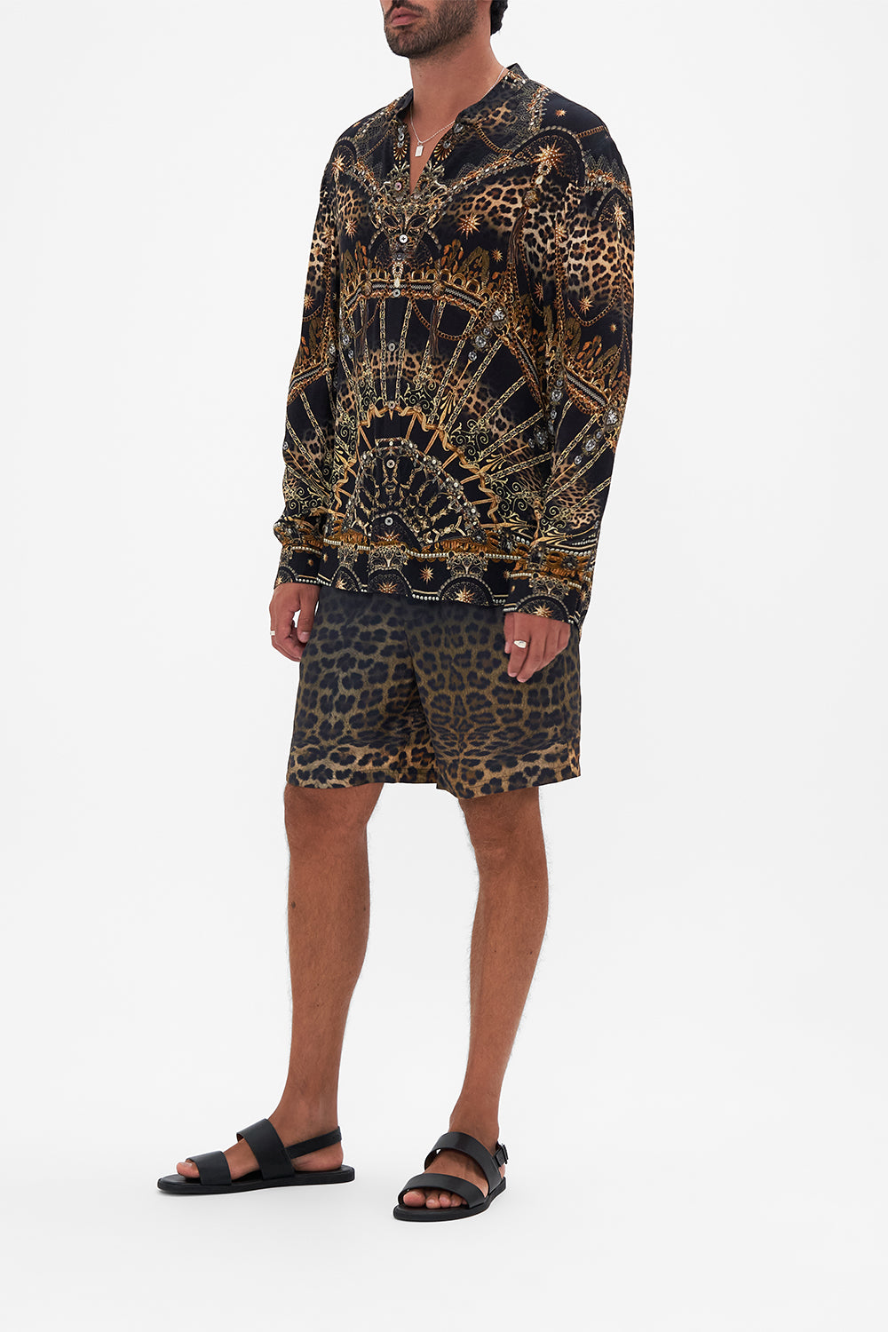 Side view of model wearing Hotel Franks By CAMILLA mens long sleeve shirt in Masked At Moonlight print 