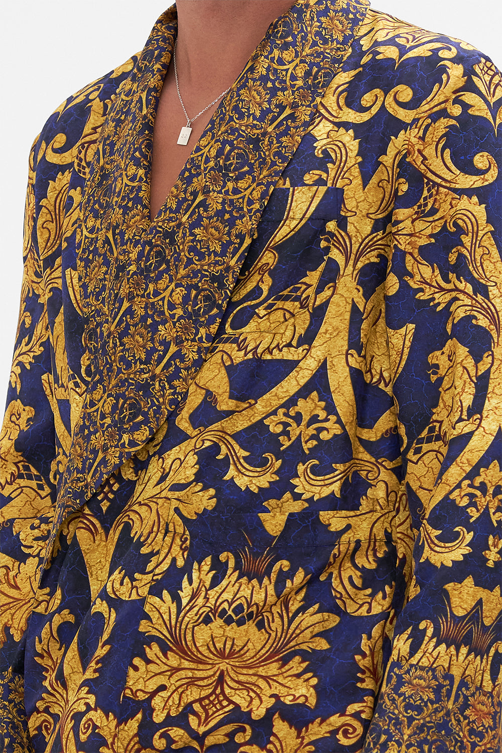 Detail view of model wearing Hotel Franks by CAMILLA mens silk robe in Venice Vignette print 