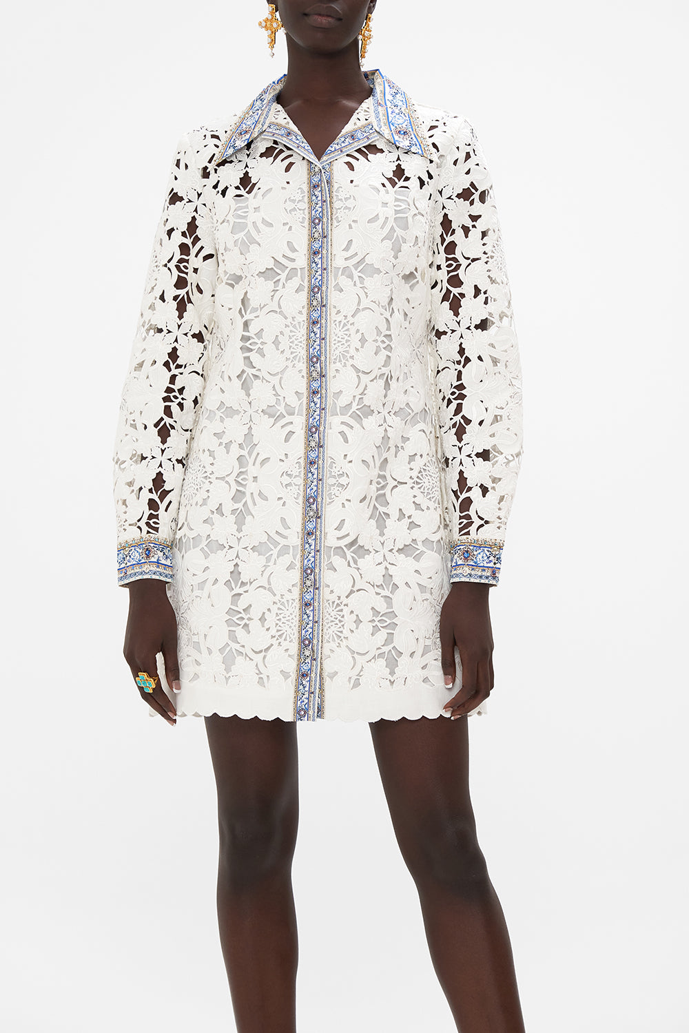 Crop view of model wearing CAMILLA silk tunic dress in Season Of The Siren print