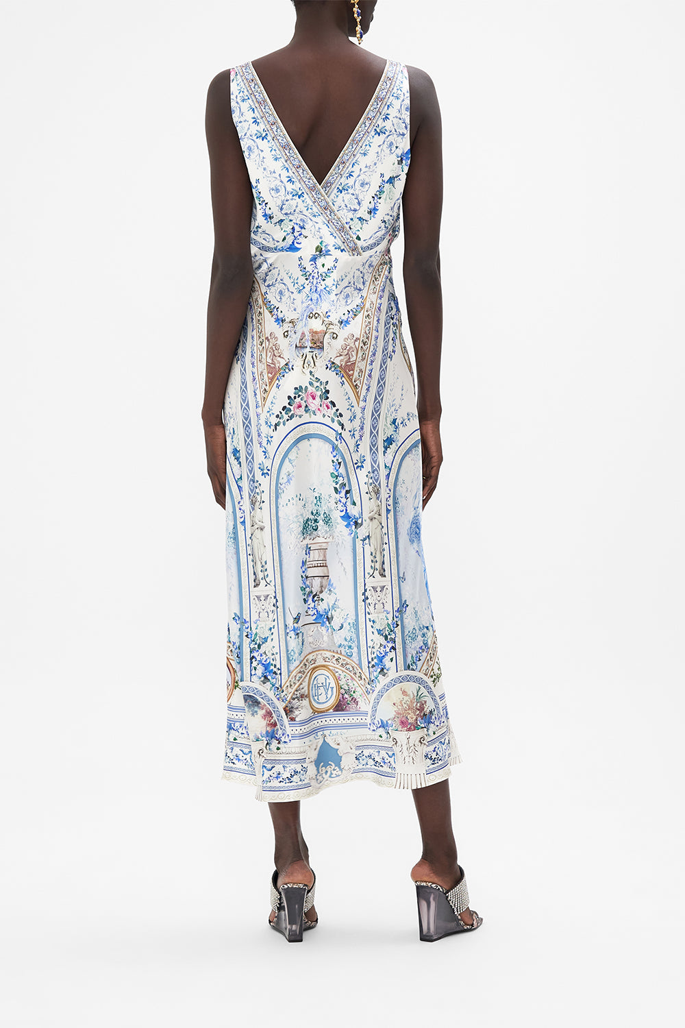 Back view of model wearing CAMILLA silk slip dress in Season of The Siren print 