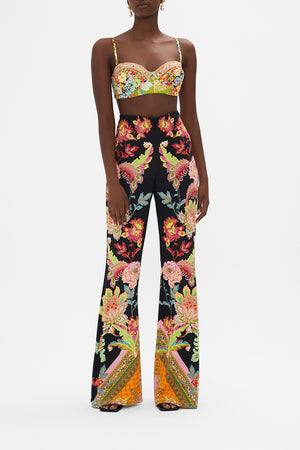 Front view of model wearing CAMILLA printed jersey flared pants in Sundowners In Sicily print
