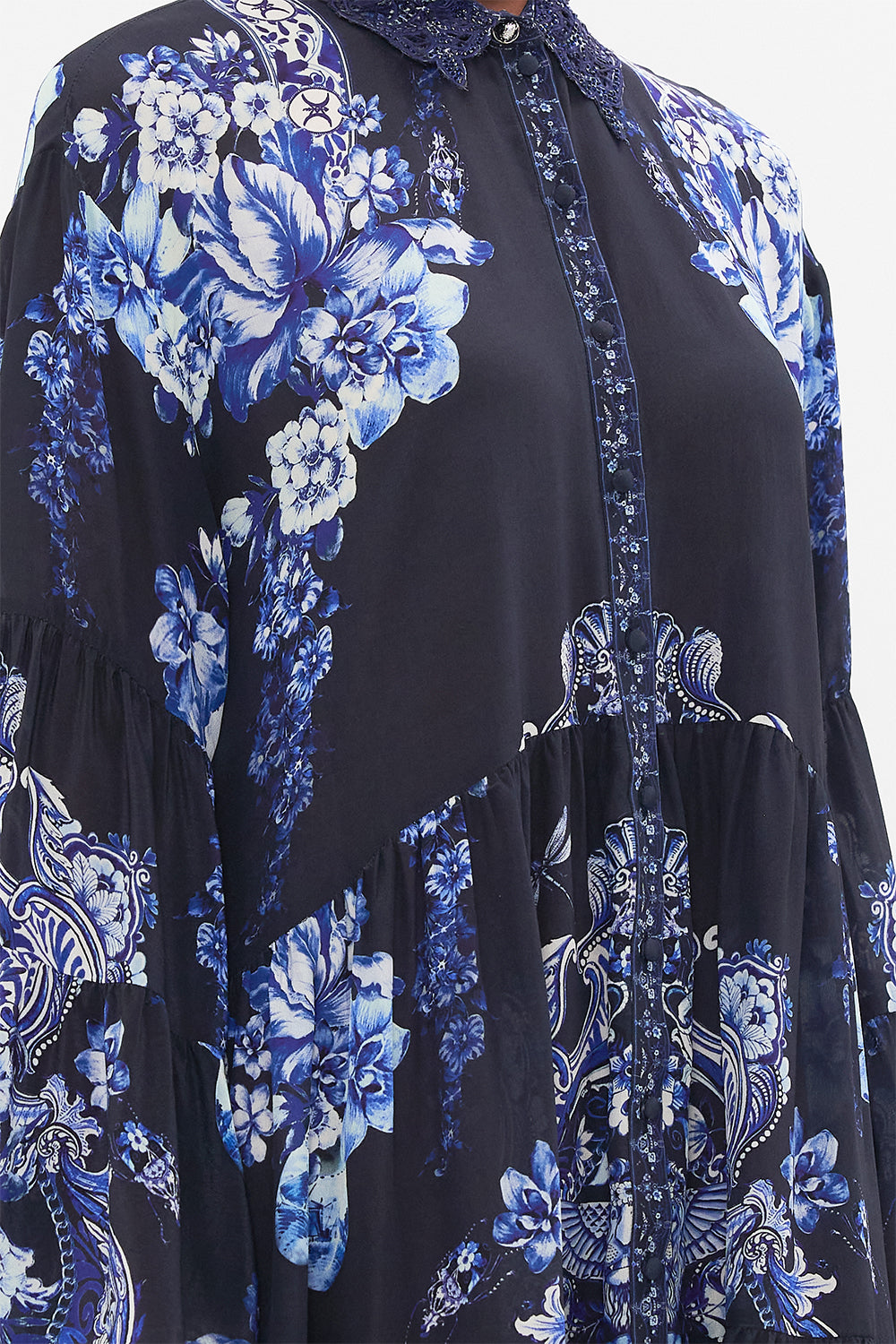 Detail view of model wearing CAMILLA silk shirt dress in Delft Dynasty print