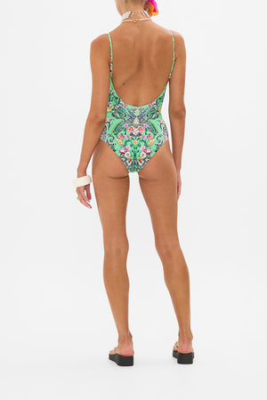 Back view of model wearing CAMILLA resort wear one piece swimsuit in Porcelain Dream print