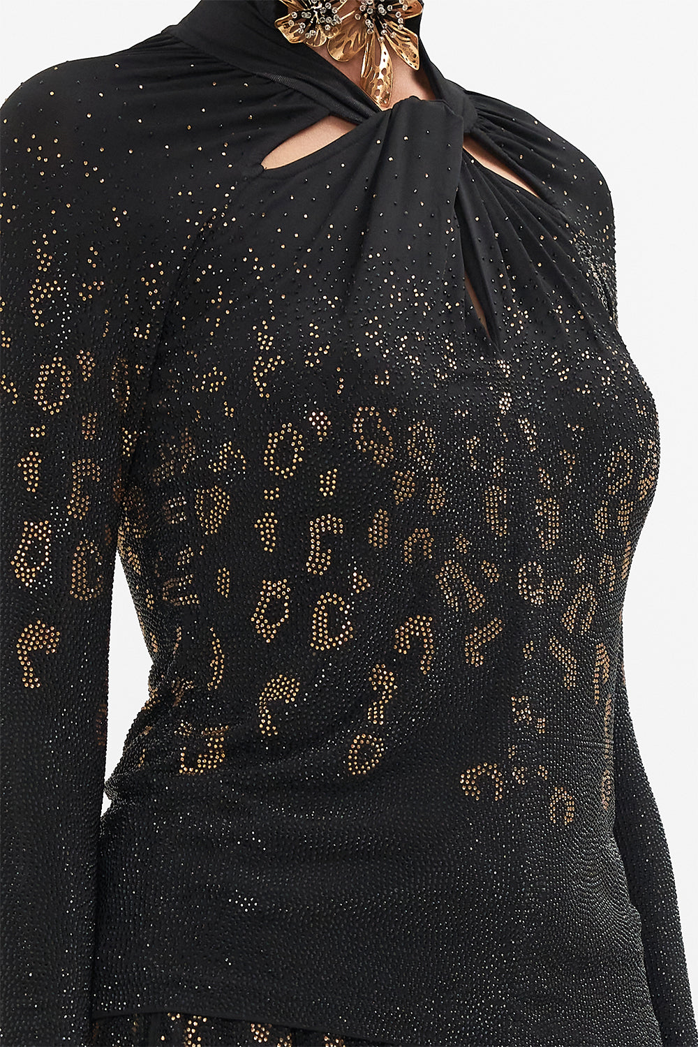 Detail view of model wearing CAMILLA black jersey top in Mosaic Muse