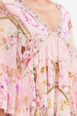 Detail view of model wearing CAMILLA pink silk dress in Fresco Fairytale print 