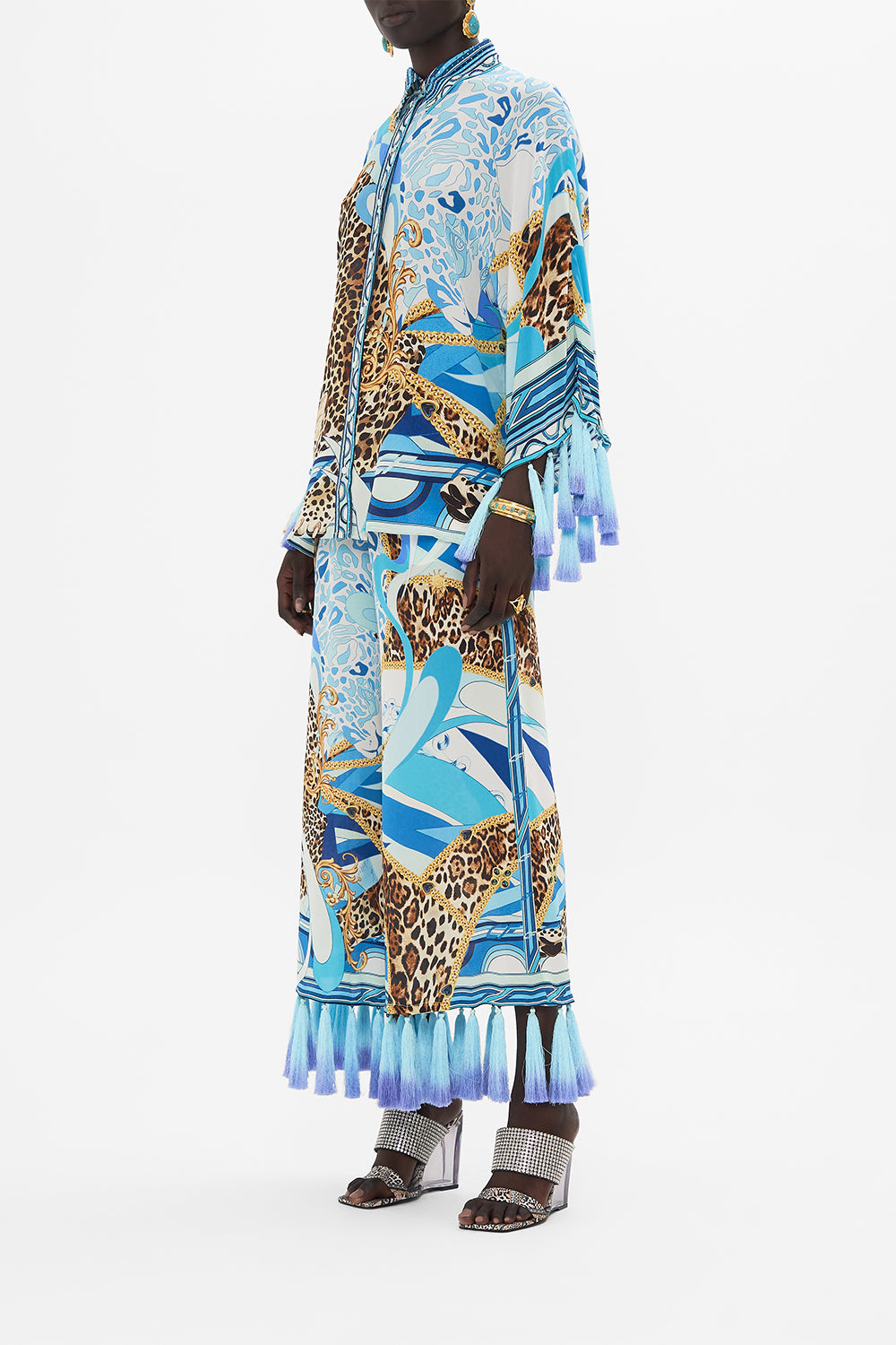 Side view of model wearing CAMILLA silk blouse in Sky Cheetah print