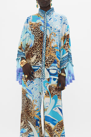 Crop view of model wearing CAMILLA silk blouse in Sky Cheetah print
