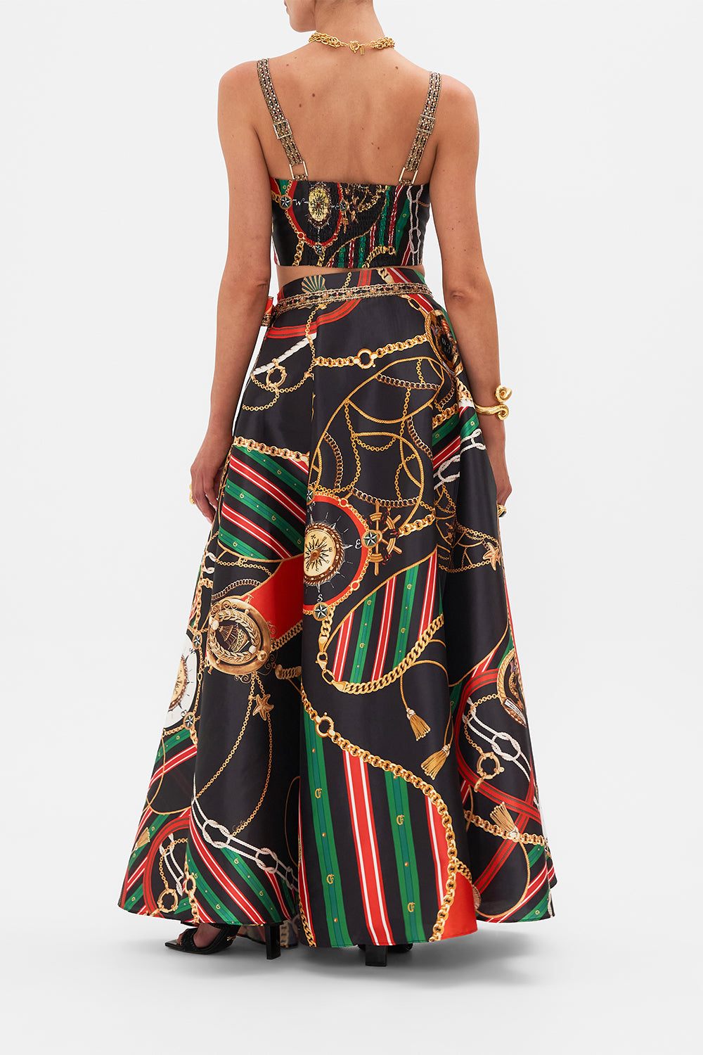 Back view of model wearing CAMILLA designer flared pants in Soul of A Stargazer print