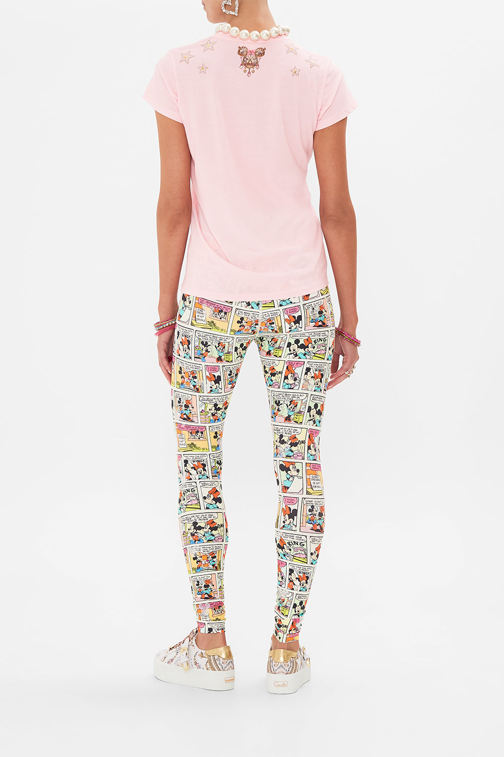 Back view of model wearing Disney x CAMILLA pink t shirt in Minnie Mouse Magic print