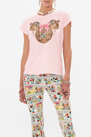 Crop view of model wearing Disney x CAMILLA pink t shirt in Minnie Mouse Magic print