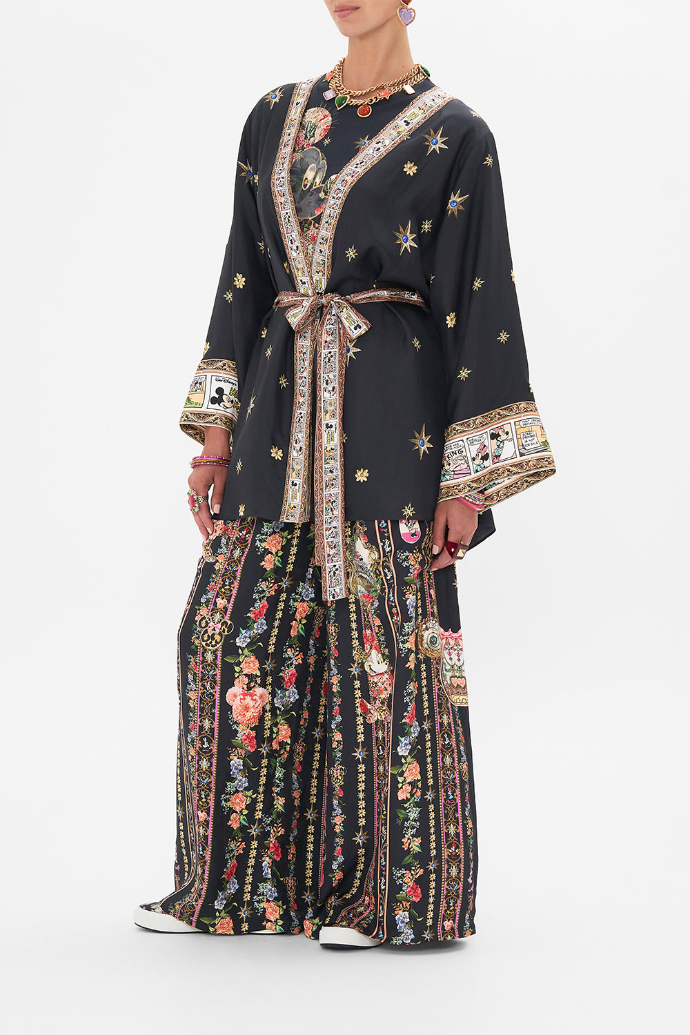 Side view of model wearing Disney x CAMILLA short silk kimono at Midnght At Minnies print 