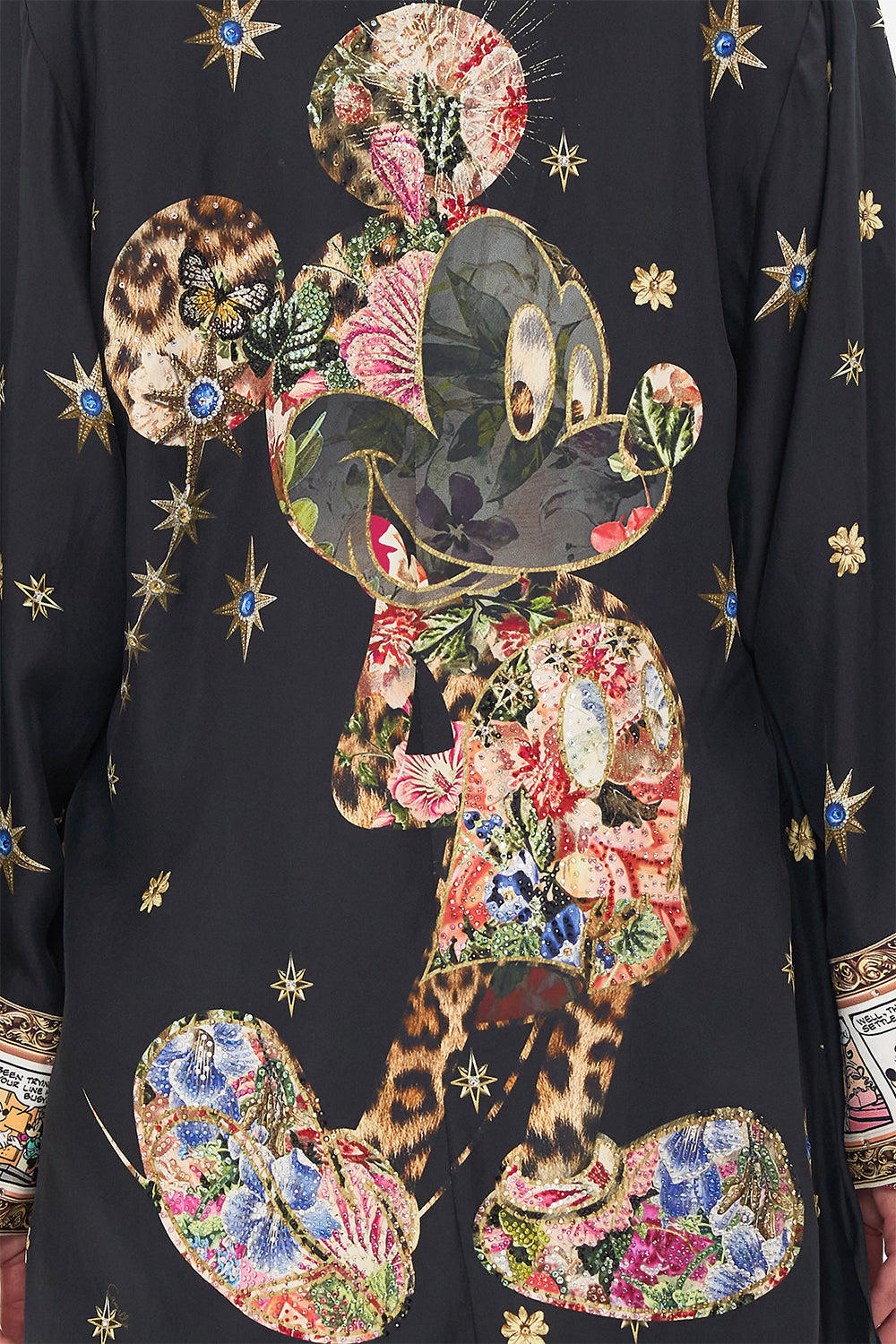 Detail view of model wearing Disney x CAMILLA short silk kimono at Midnght At Minnies print 