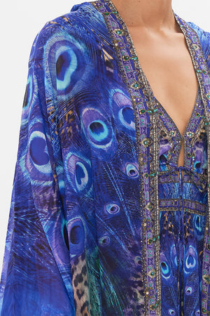 Detail view of model wearing CAMILLA silk robe in Peacock Rock print