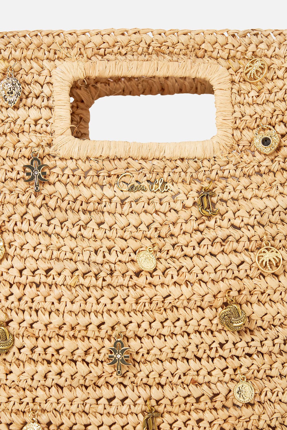 The CAMILLA RAFFIA MINI NORTH SOUTH TOTE WITH CHARMS NATURAL