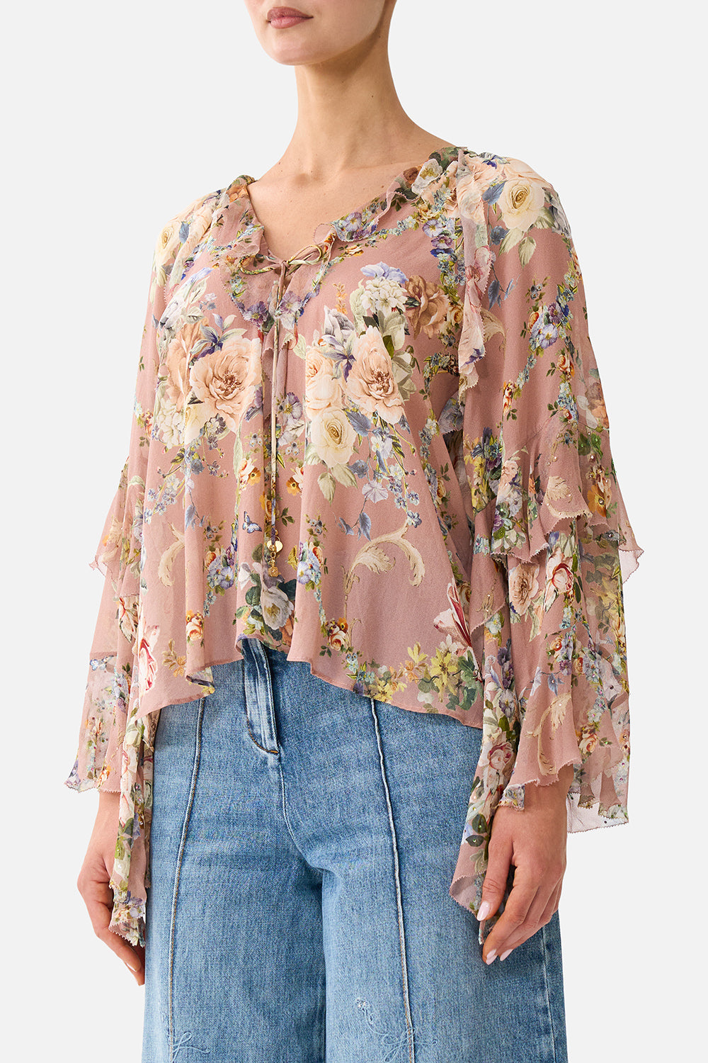 LACE UP V NECK BLOUSE WITH CASCADE RUFFLES CHAMBER OF BLOOMS