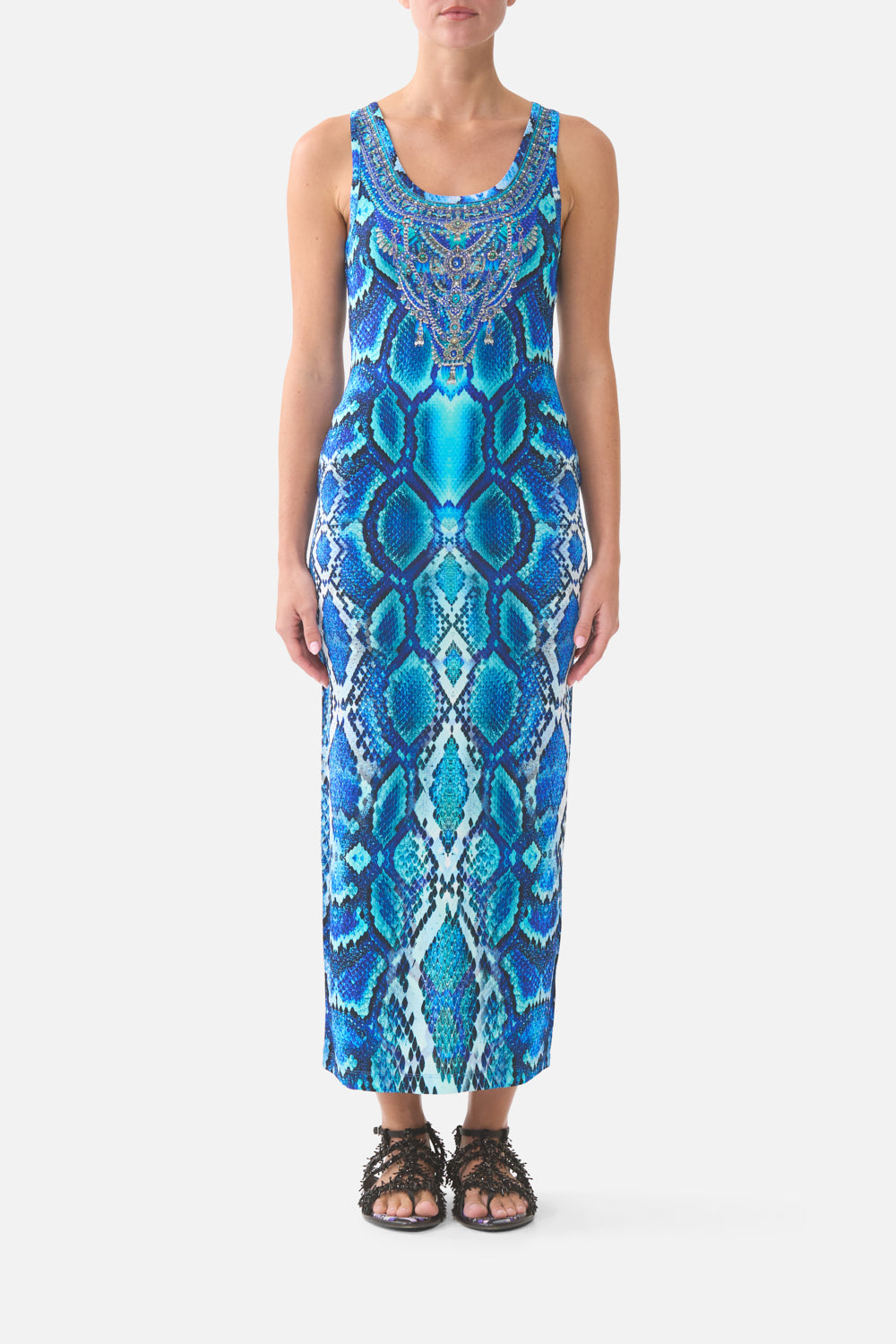 Woman wearing a blue patterned dress on a white background