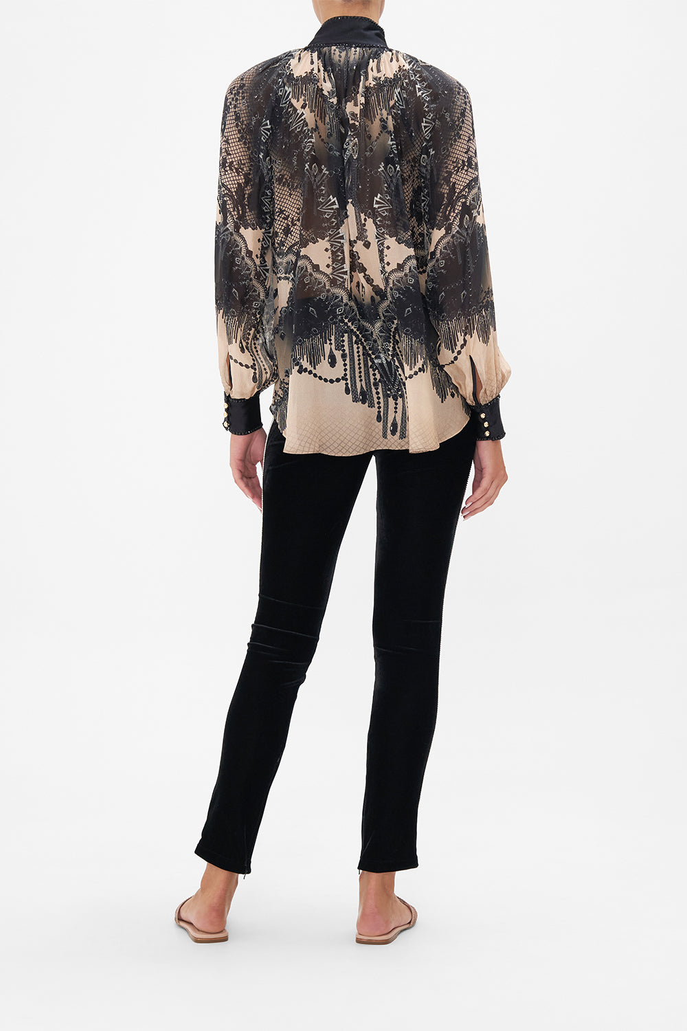 Back view of model wearing CAMILLA black velvet pants in Curtain Call Chaos