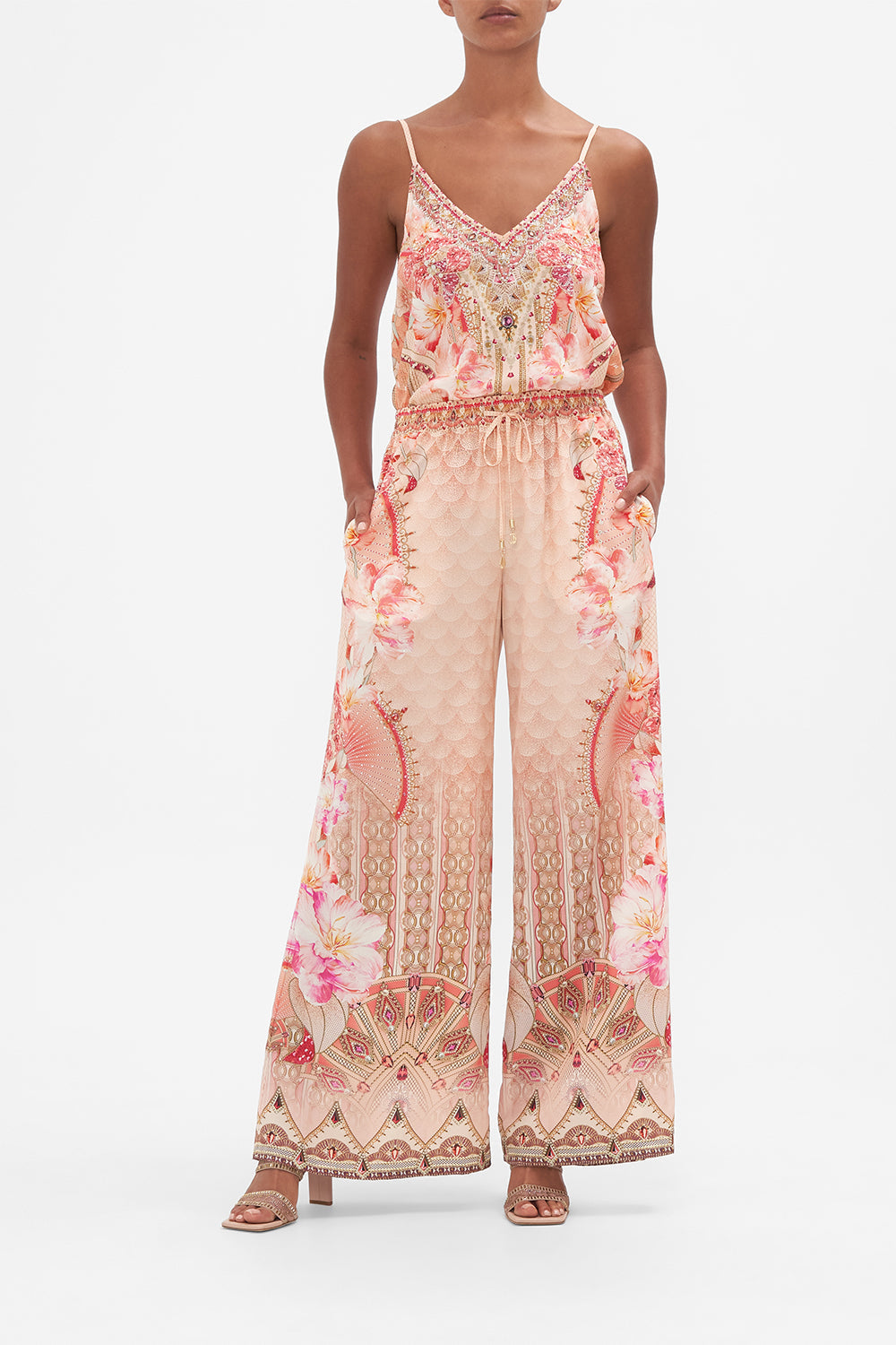 Front view of model wearing CAMILLA silk pants in Adore Me print