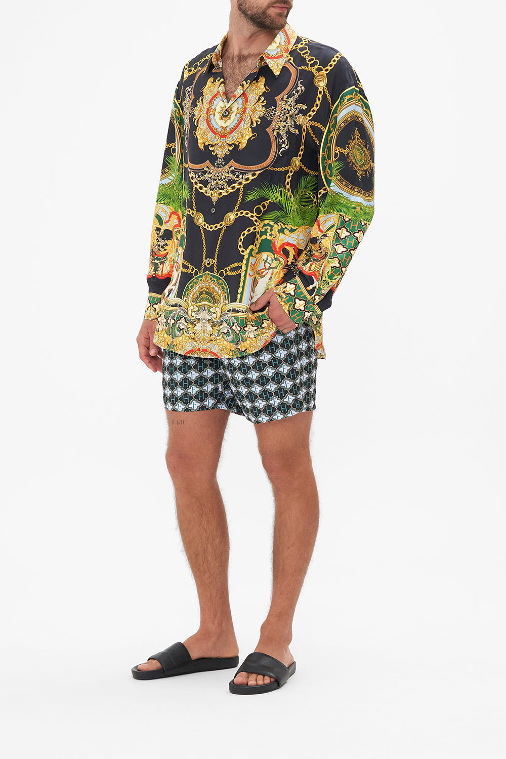 Back view of model wearing Hotel Franks by CAMILLA mens silk oversized sleeve button through shirt in Jealousy and Jewels print